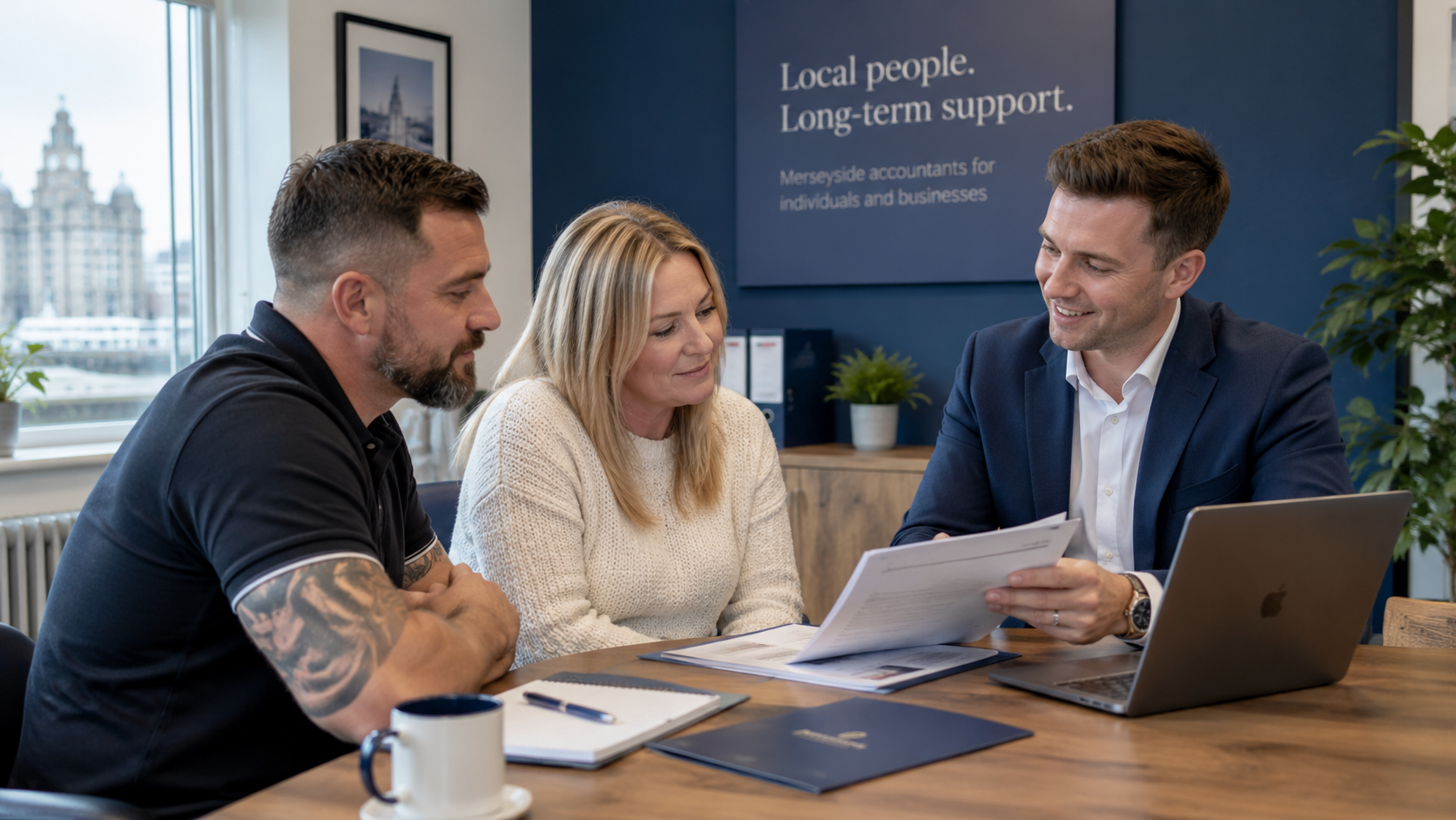 An MCPW accountant going through a set of accounts with two clients in the office